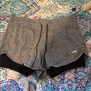 Grey shorts with small white strips